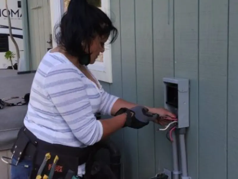 Licensed electrician wiring an exterior subpanel in Hillsboro