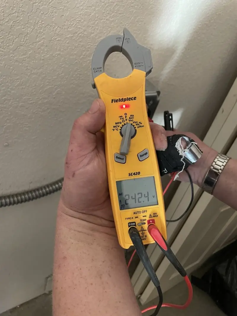 Voltage testing with clamp meter during Circuit Breaker Repair in Hillsboro